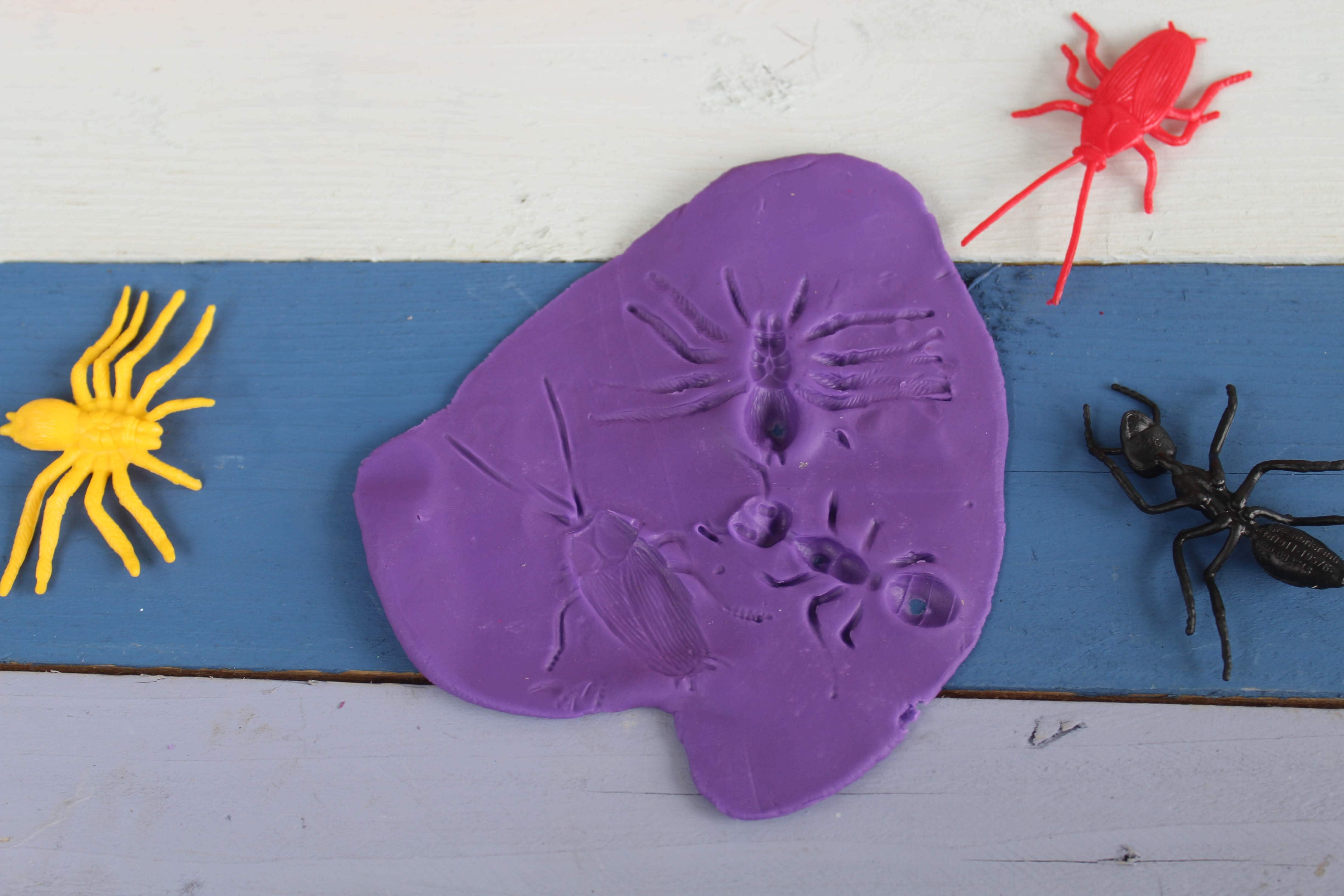 Playdough Insect Fossils Idea - Milestone Mom, LLC